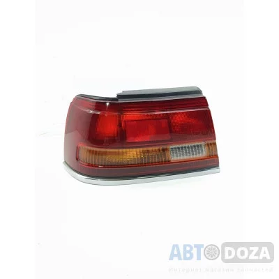 Ліхтар задній лівий Mazda 626 GD (хетчбек) б/в оригінал (дефект)