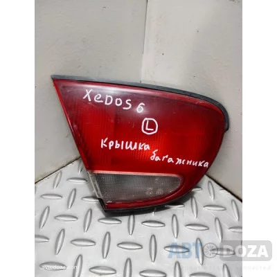 Фонарь задній Mazda 626 Xedos 6 седан (L) б/у з пошкодженням у кр. багажнику - Купити в Одесі з доставкою по Україні.